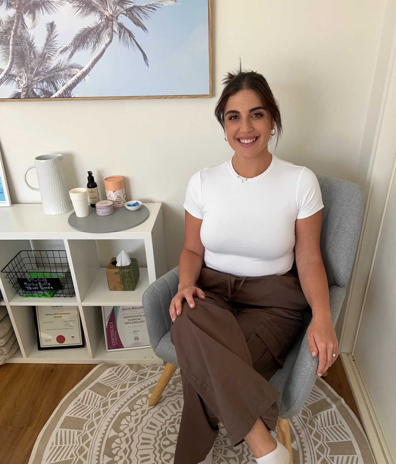 Karlie from Korr Massage Therapies seated in the Seaford studio